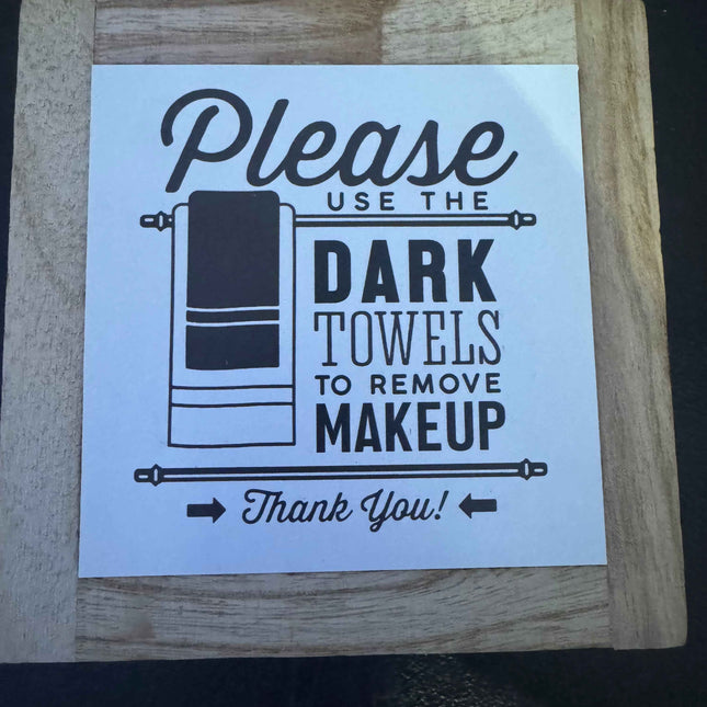 Please use dark towel for make up sign